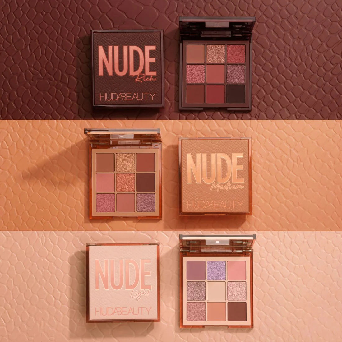 Collection of Huda Beauty nude eyeshadow palettes on a textured brown and pink background