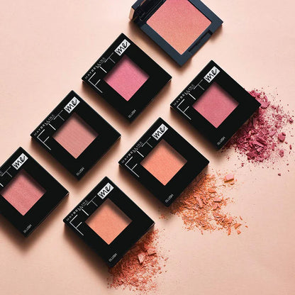 Black square blush palettes with pink blushes on a pink background