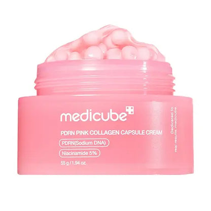 A pink collagen capsule cream jar with 'medicube' branding on a white background